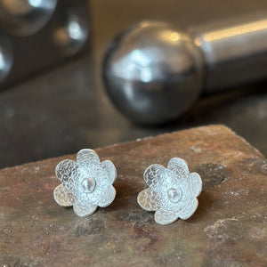 Textured silver flower earrings with a silver circle centre
