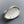 Large chunky sterling silver textured abstract ring with blue and clear diamonds on grey background