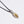 Silver seed pod shaped pendant with oxidised chain
