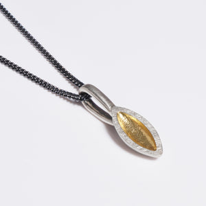 Silver seed pod shaped pendant with oxidised chain