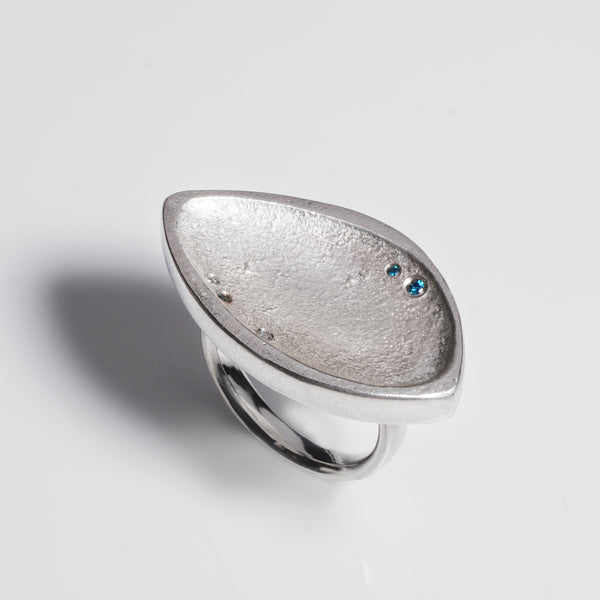 Large chunky sterling silver abstract ring with blue and clear diamonds